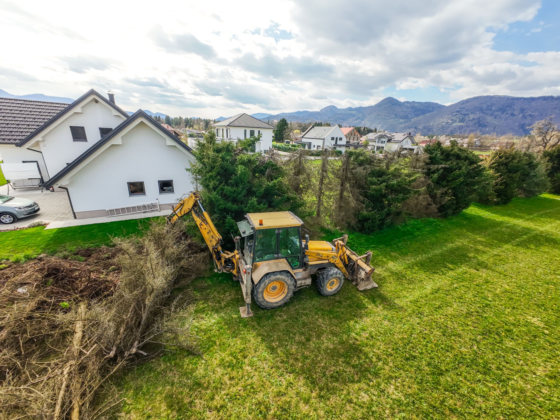 Aerial View of Backhoe Loader Clearing Pine Trees